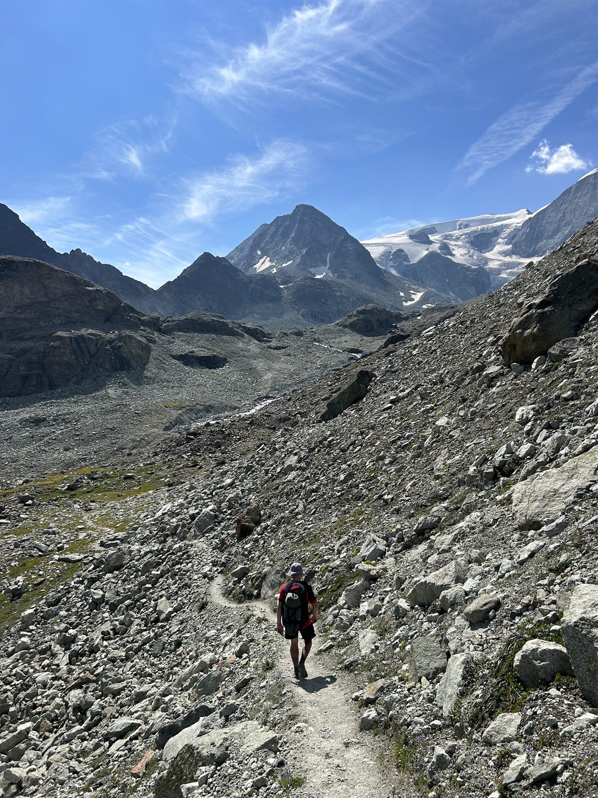Will hiking through a high mountain landscape